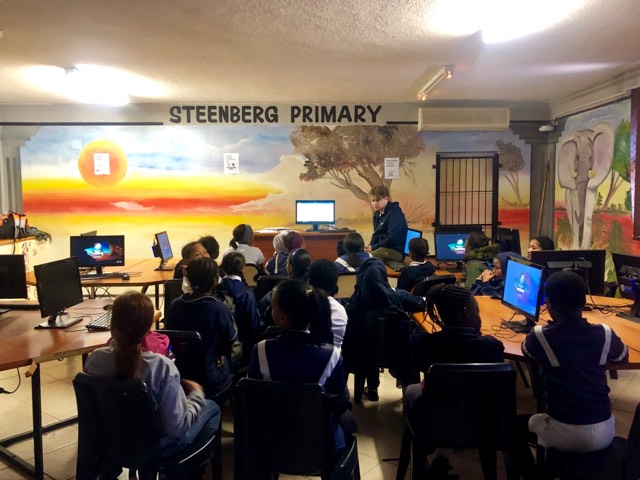 Heres a picture of one of our volunteers going over Microsoft word. 